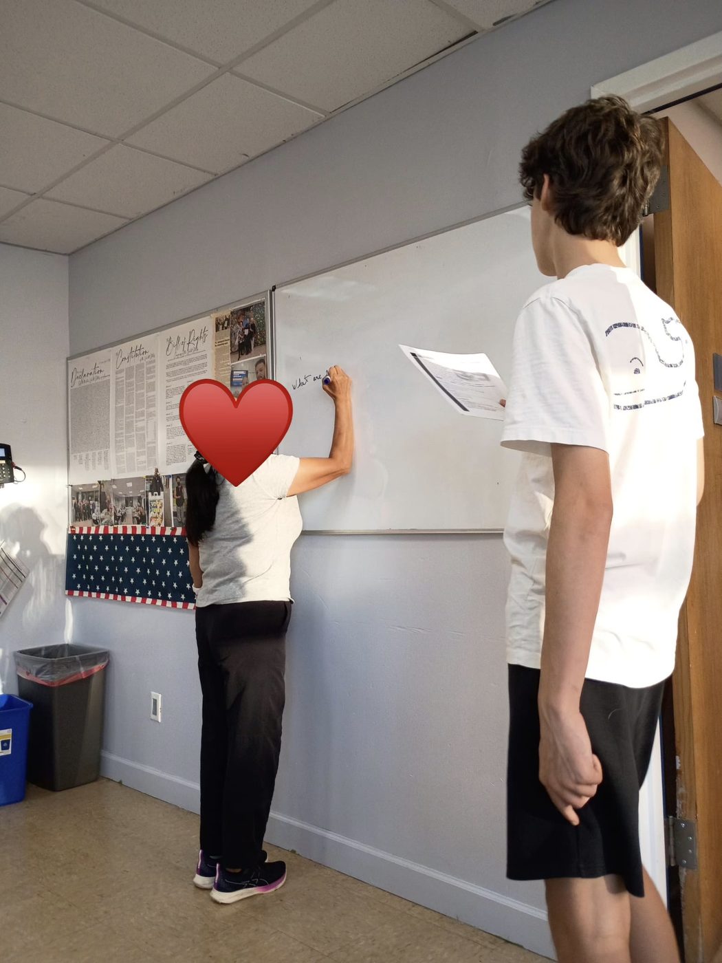 Going over the civics questions at the whiteboard
